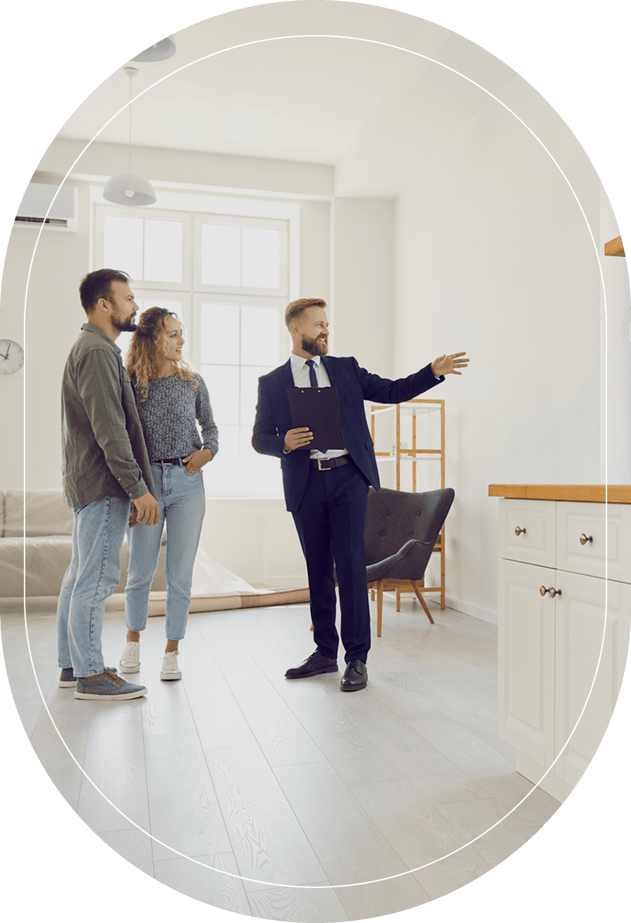 Couple viewing potential new house interior