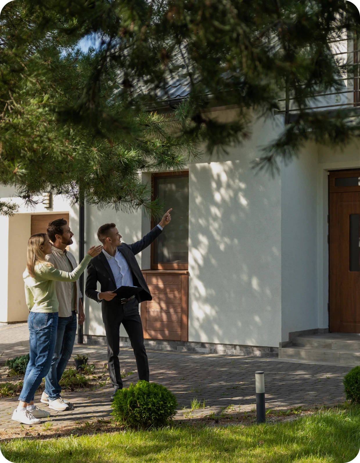 Real estate agent showing property to couple